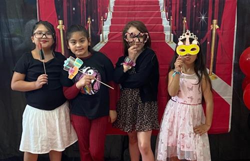 students posing with prompts